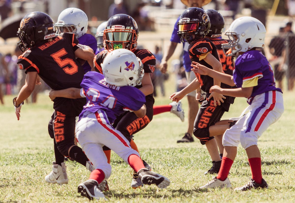 kids playing little league football